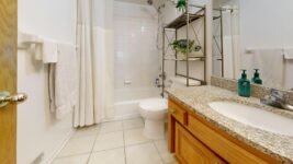 Modern bathroom scale on a tiled floor