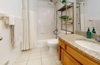 Modern bathroom scale on a tiled floor