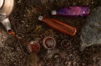 Relaxing beverages poured in nature, featuring eco-friendly bottles on rocky terrain.