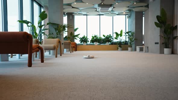 Robotic Vacuum Cleaner Cleaning Office Carpet